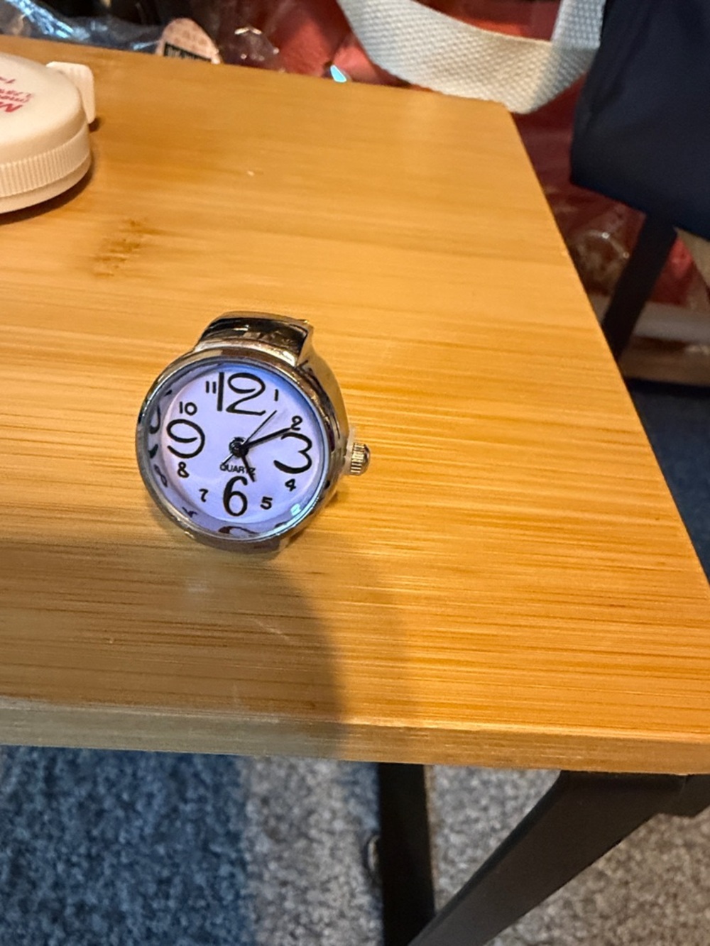 Silver ring with purple face